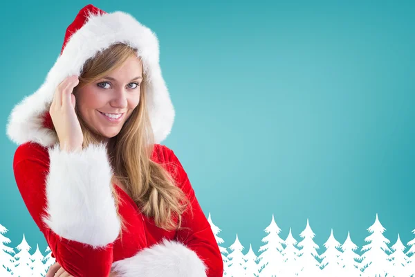 Composite image of festive blonde smiling at camera — Stock Photo, Image