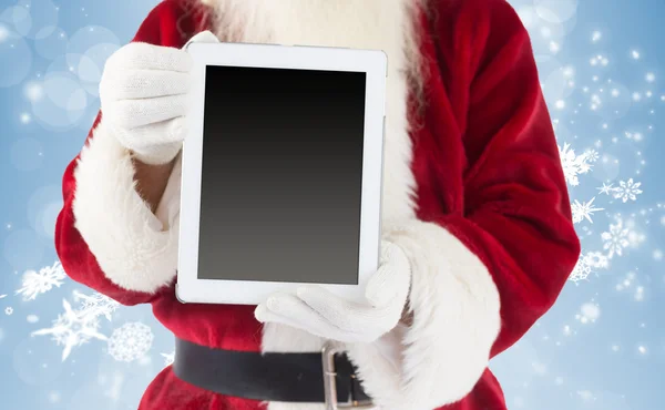 Santa claus mostrando tablet pc — Fotografia de Stock