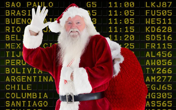 Imagem composta de santa claus acenando — Fotografia de Stock