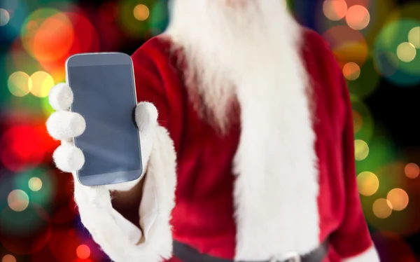 Papai Noel mostrando smartphone — Fotografia de Stock