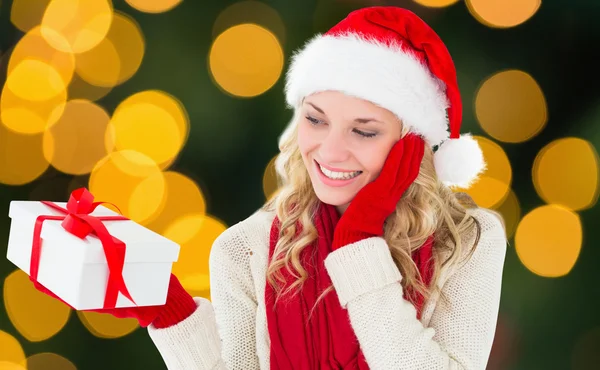 Happy festive blonde with gift Royalty Free Stock Photos