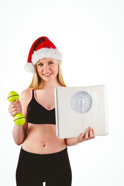 Festive fit blonde smiling at camera clipart