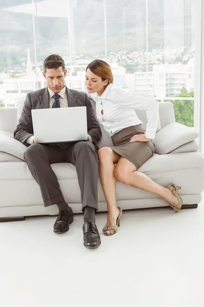 Young business people using laptop — Stock Photo, Image