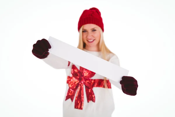 Festive blonde showing a blank banner — Stock Photo, Image