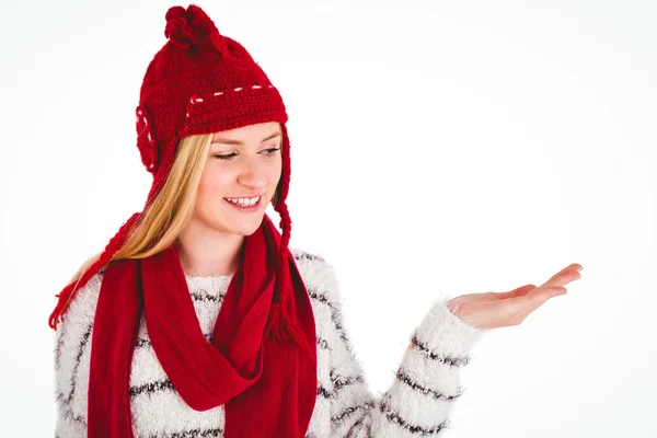 Festive blonde presenting with hand — Stock Photo, Image