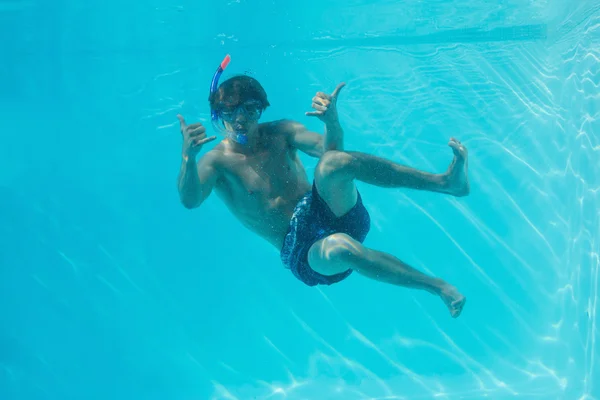 Young man wearing snorkel underwater — Stock Photo, Image