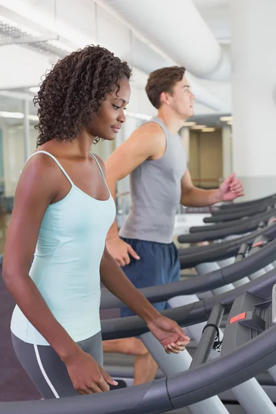 Fit people running on treadmills — Stock Photo, Image