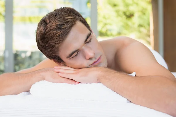 Man lying on massage table — Stock Photo, Image