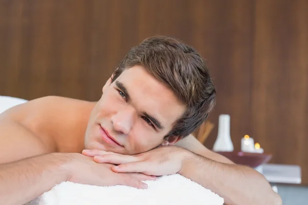 Man lying on massage table — Stock Photo, Image