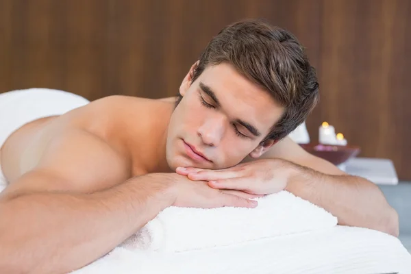 Man lying on massage table — Stock Photo, Image