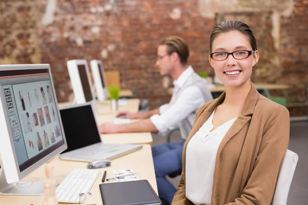 Smiling photo editors using computers in office — Stock Photo, Image