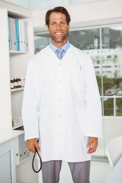 Confident male doctor in medical office — Stock Photo, Image