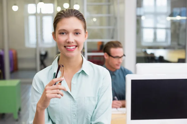 Smiling female photo editor in office — Stock Photo, Image