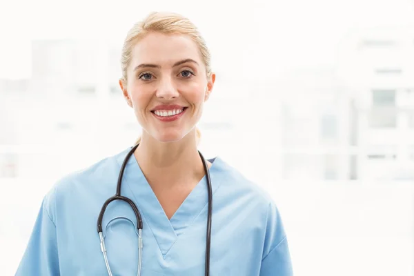 Portrait of a smiling confident female doctor Stock Image