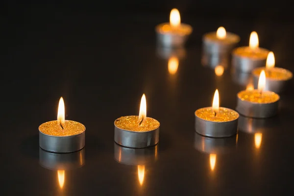 Eight small candles burning — Stock Photo, Image