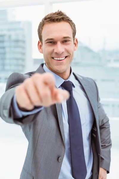 Smart young businessman in suit pointing at you — Stock Photo, Image