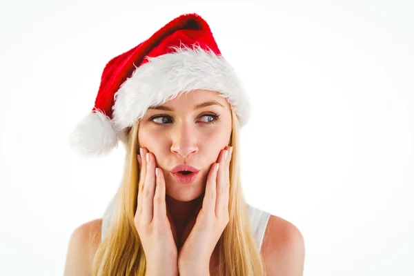 Festive blonde looking surprised with hands on face — Stock Photo, Image