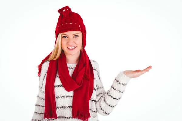 Festive blonde presenting with hand — Stock Photo, Image