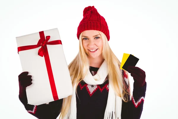 Festive blonde holding a gift — Stock Photo, Image