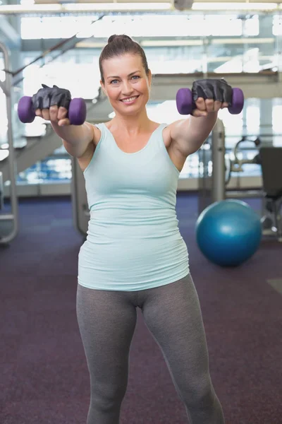Fit brunette working out with dumbbells — Stock Photo, Image