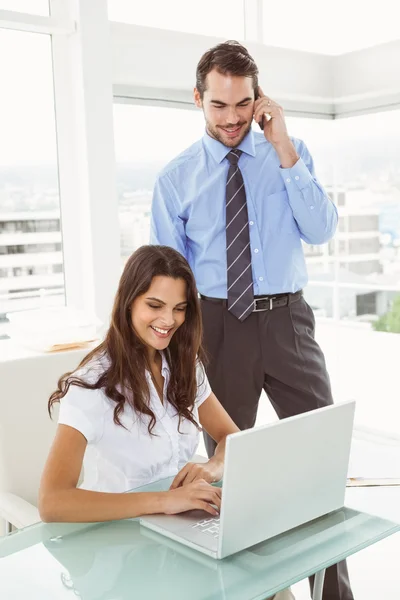 Business people using laptop in office — Stock Photo, Image