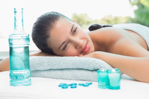 Woman lying on massage table — Stock Photo, Image