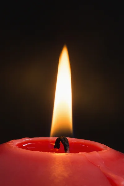 Red candle burning brightly — Stock Photo, Image