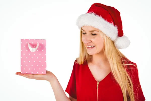Festive blonde holding a gift bag Stock Image