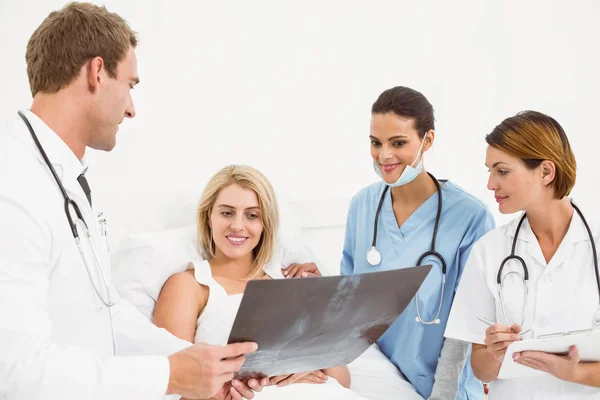 Portrait of doctors and patient with x-ray Royalty Free Stock Photos