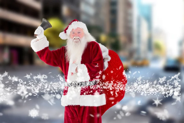 Composite image of santa claus ringing bell — Stock Photo, Image