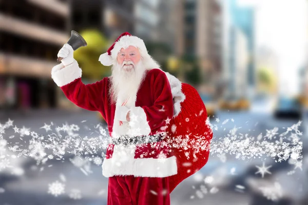 Složený obraz santa Claus zvoní zvonek — Stock fotografie