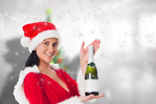 Složený obraz ženy držící láhev šampaňského — Stock fotografie