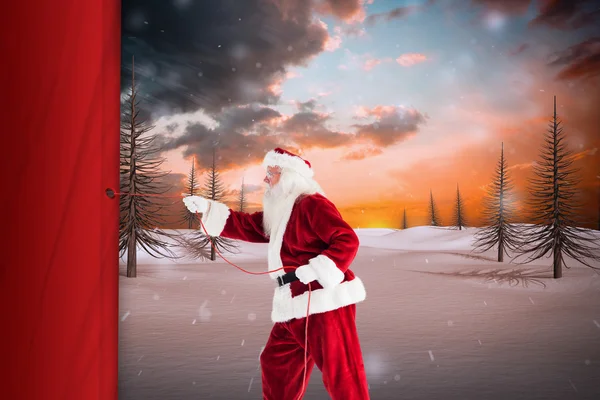 Image composite du Père Noël tire quelque chose avec une corde — Photo