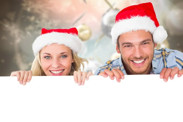 Composite image of young festive couple — Stock Photo, Image