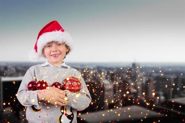 Composite image of festive boy smiling — Stock Photo, Image