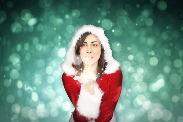 Pretty girl in santa outfit blowing — Stock Photo, Image