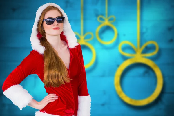 Composite image of cool santa girl wearing sunglasses — Stock Photo, Image