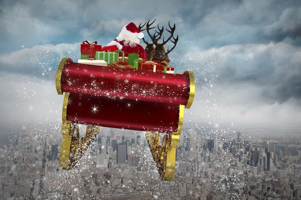 Složený obraz Santa letí jeho sáně — Stock fotografie