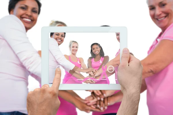 Composite image of hand holding tablet pc — Stock Photo, Image