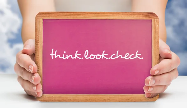 Composite image of females hands showing pink board — Stock Photo, Image