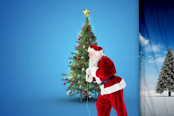 Immagine composita di Babbo Natale tirando corda — Foto Stock
