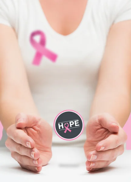 Woman presenting breast cancer awareness message — Stock Photo, Image