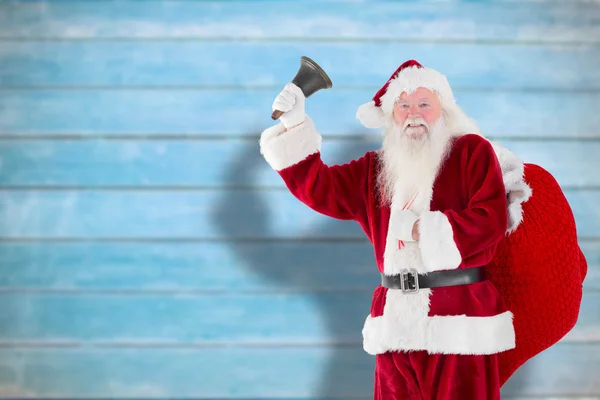 Immagine composita di Babbo Natale che suona la campana — Foto Stock