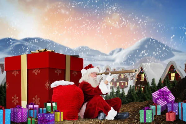 Immagine composita di Babbo Natale che guarda attraverso un telescopio — Foto Stock