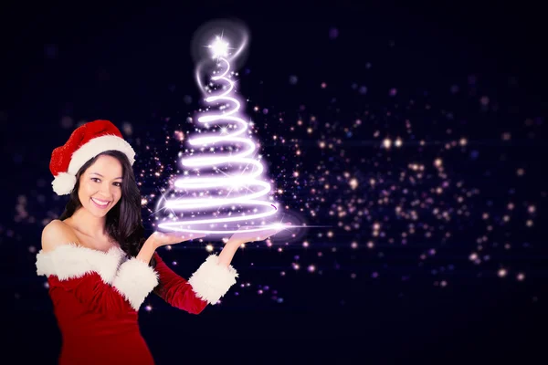 Pretty girl presenting in santa outfit — Stock Photo, Image