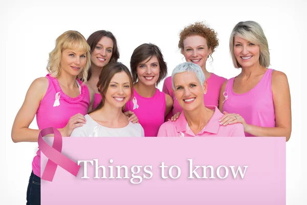 Composite image of beautiful women posing and wearing pink for b — Stock Photo, Image