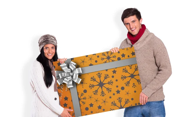 Composite image of young couple holding a poster — Stock Photo, Image