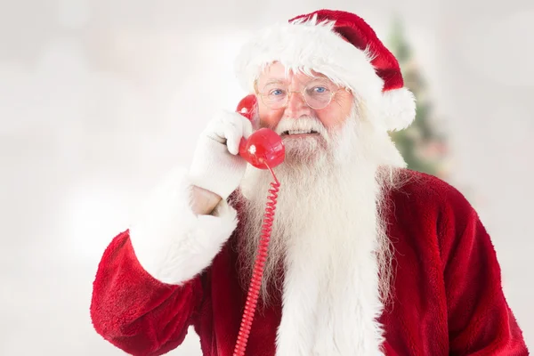 Samengestelde beeld van de kerstman op de telefoon — Stockfoto