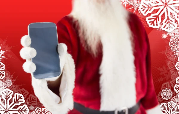 Composite image of santa claus showing smartphone — Stock Photo, Image