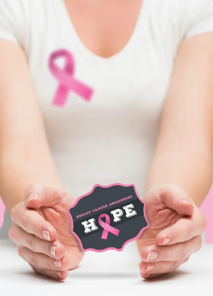 Woman presenting breast cancer awareness message — Stock Photo, Image